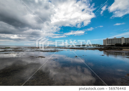 Blue sky and reflection 56976448