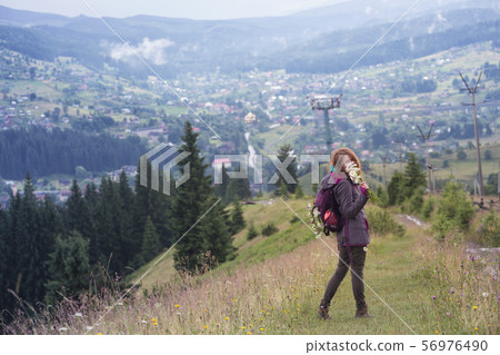 girl with a bouquet of daisies girl with a bouquet of daisies 56976490