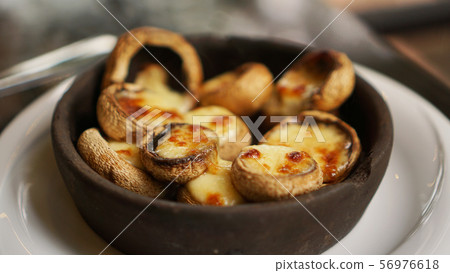 Soko mushrooms with suluguni cheese, traditional georgian food 56976618