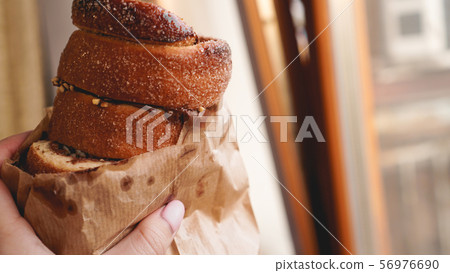 Trdelnik - traditional Czech sweet pastry sold in the streets of Prague 56976690