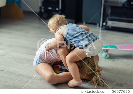 Two little siblings children quarrelling after 56977630