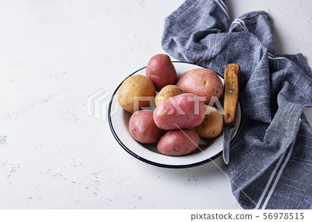 Various sorts of raw organic potatoes 56978515