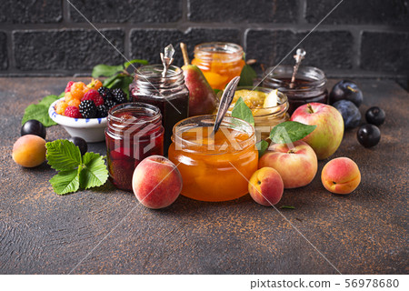 Assortment of different jams in jars 56978680