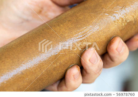 Close-up plumber hand holding used dirty rusty Close-up plumber hand holding used dirty rusty 56978760