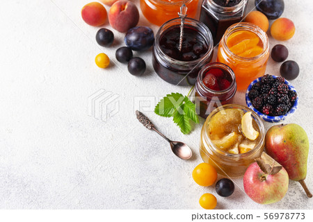 Assortment of different jams in jars 56978773