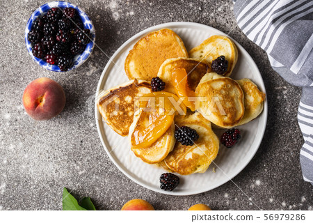 Pancakes with apricot jam and berry Pancakes with apricot jam and berry 56979286