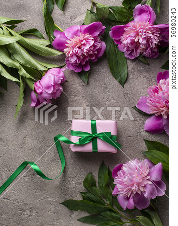 Pink peony flowers and gift box 56980243