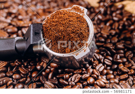 Coffee beans and portafilter for espresso coffee Coffee beans and portafilter for espresso coffee 56981171
