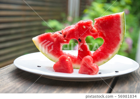 Watermelon hearts nature green leaves background 56981834