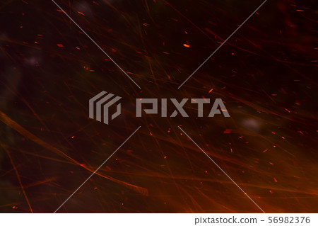 The sparkle of the flames in the dark background. 56982376