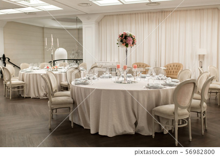 The white round banquet table in the restaurant is The white round banquet table in the restaurant is 56982800