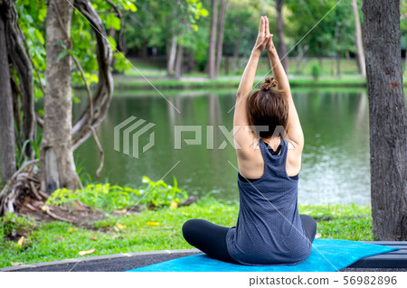 Woman more than 50 year old practicing yoga 56982896