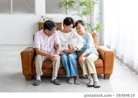 Parent and child three generations senior couple daughter and grandchild Parent and child three generations senior couple daughter and grandchild 56984619