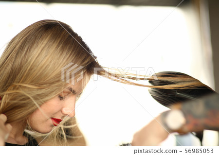 Blonde Woman Getting Hairstyle Closeup Photography 56985053
