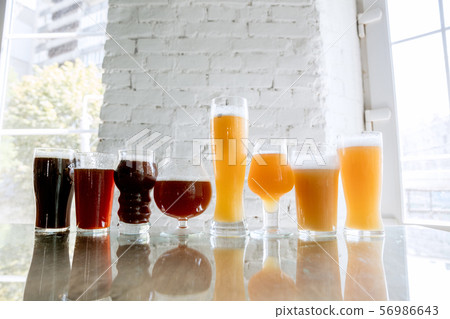 Glasses of different kinds of beer, time for oktoberfest Glasses of different kinds of beer, time for oktoberfest 56986643