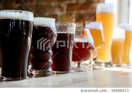 Glasses of different kinds of beer, time for oktoberfest Glasses of different kinds of beer, time for oktoberfest 56986813