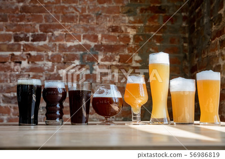 Glasses of different kinds of beer, time for oktoberfest Glasses of different kinds of beer, time for oktoberfest 56986819