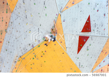 girl climbing up the wall 56987001