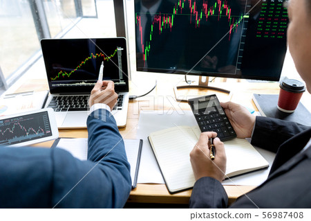 businessman sit at ther table looking at computer businessman sit at ther table looking at computer 56987408