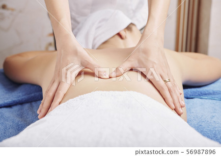 Professional back massage 56987896