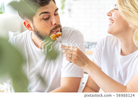 Happy married couple is having fun at home 56988124