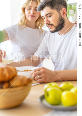 Pretty woman holding a bottle of milk Pretty woman holding a bottle of milk 56988170