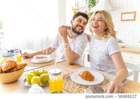 Happy couple is having breakfast at home 56988227