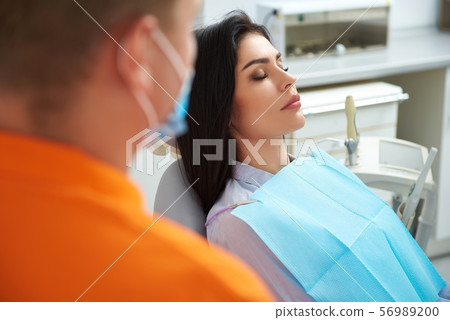 Young woman is lying in dentist chair Young woman is lying in dentist chair 56989200
