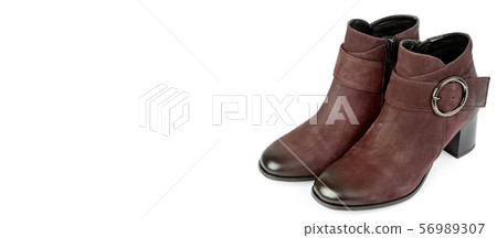 Stylish suede ankle boots isolated on white 56989307
