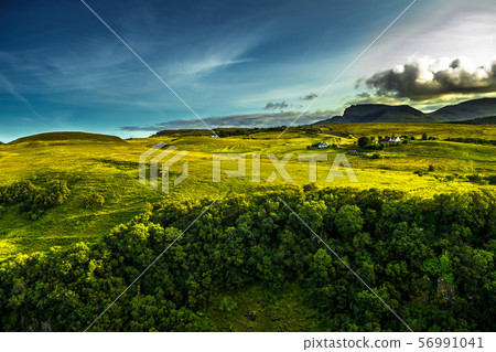 Rural Landscape With Remote Houses At The Old Man Storr Formation On The Isle Of Skye In Scotland Rural Landscape With Remote Houses At The Old Man Storr Formation On The Isle Of Skye In Scotland 56991041