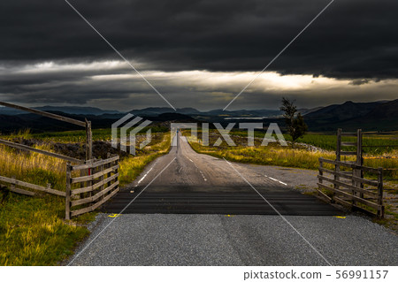 Narrow Road Through Rural Highland Landscape Near Loch Ness In Scotland 56991157
