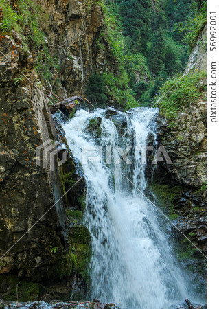 Waterfall in the mountains 56992001