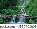Mountain river across the fallen trees 56992006