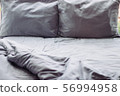 Messy grey hotel bed, honeymoon, background 56994958