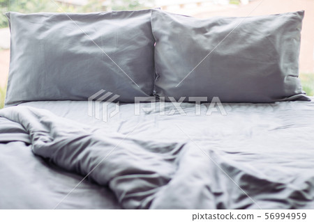 Messy grey hotel bed, honeymoon, background 56994959