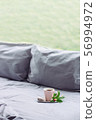 grey Bed next to window, coffee, donut, flower 56994972