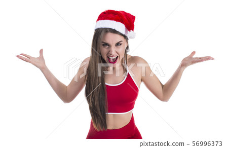 Young beautiful sporty woman wearing christmas hat over isolated white background crazy and mad 56996373