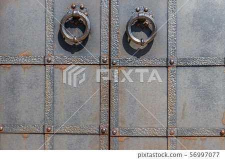Close-up of the old iron black door Close-up of the old iron black door 56997077