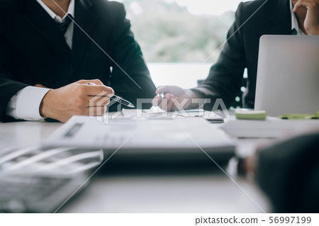Business people analyzing investment graph meeting Business people analyzing investment graph meeting 56997199