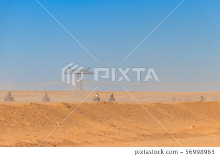 Safari trip through egyptian desert driving ATV. Safari trip through egyptian desert driving ATV. 56998963