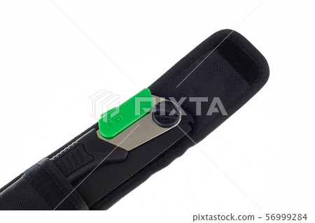 Closeup of a folding handsaw in pouch Closeup of a folding handsaw in pouch 56999284