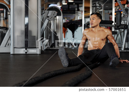 Exhausted sportsman in gym Exhausted sportsman in gym 57001651