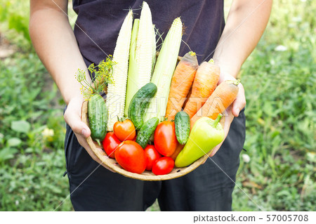 man holding a basket of 57005708