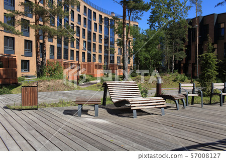 wooden boardwalk bench in the foreground 57008127