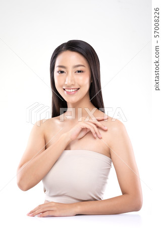 Beautiful Young Asian Woman Looking While Touching Shoulder feeling so happy and cheerful with healthy Clean and Fresh skin,isolated on white background,Beauty Cosmetology Concept Beautiful Young Asian Woman Looking While Touching Shoulder feeling so happy and cheerful with healthy Clean and Fresh skin,isolated on white background,Beauty Cosmetology Concept 57008226