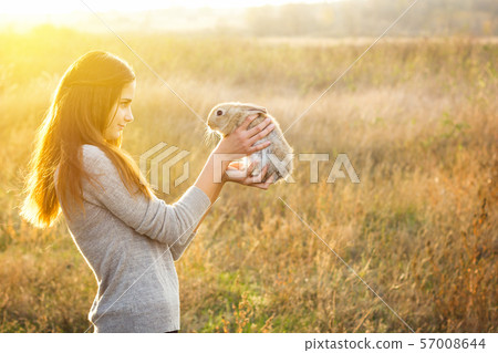 the girl with the rabbit.happy the girl with the rabbit.happy 57008644