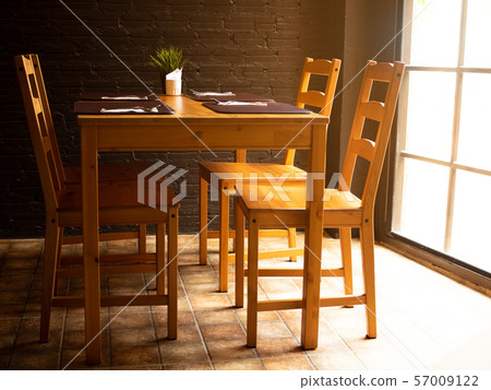 Wooden Dining table and chairs in restaurant. 57009122