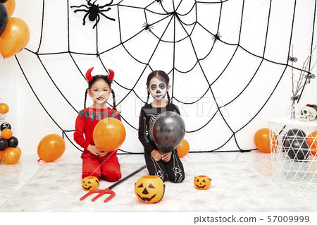 Asian child girls in halloween costumes 57009999