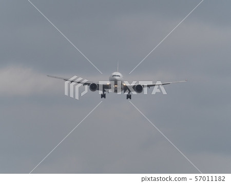 Boeing 777 landing at Osaka International Airport 57011182