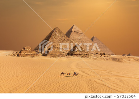 The Pyramids in the sunset desert of Giza, Egypt The Pyramids in the sunset desert of Giza, Egypt 57012504